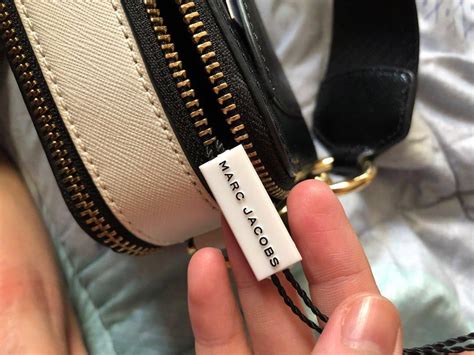 how to spot a fake marc jacobs snapshot bag